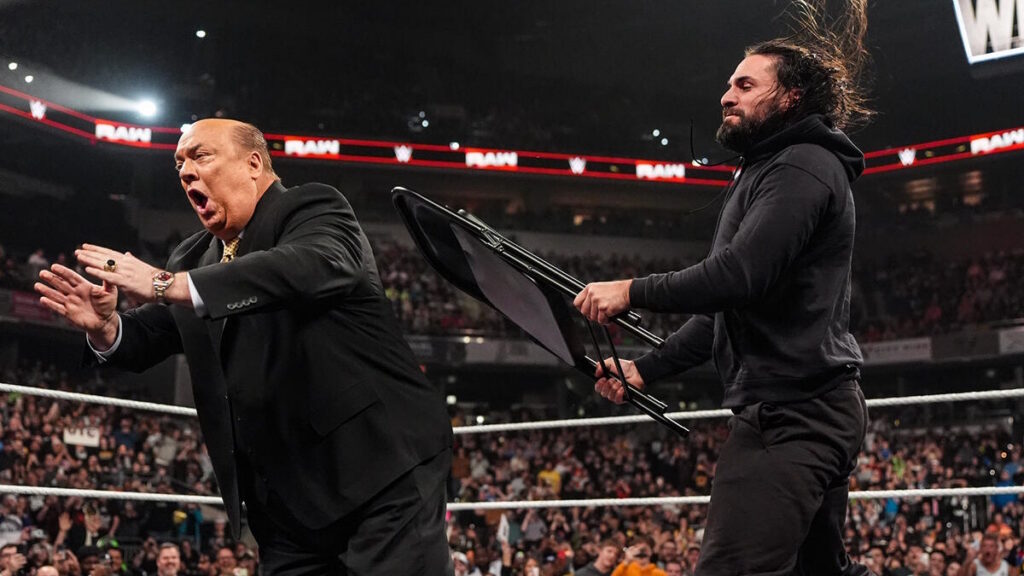 Seth Rollins hitting Paul Heyman with a chair on WWE Raw