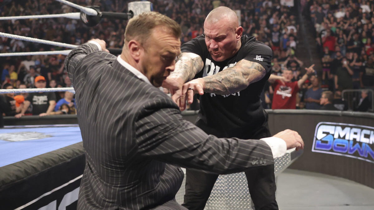 Randy Orton pushing WWE SmackDown GM Nick Aldis