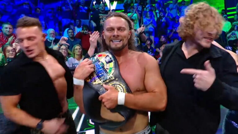 Lexis King as WWE Speed Men's Champion alongside Charlie Dempsey and Channing 'Stacks' Lorenzo