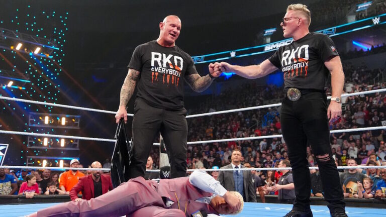 Randy Orton and Pat McAfee stand over Cody Rhodes on WWE SmackDown