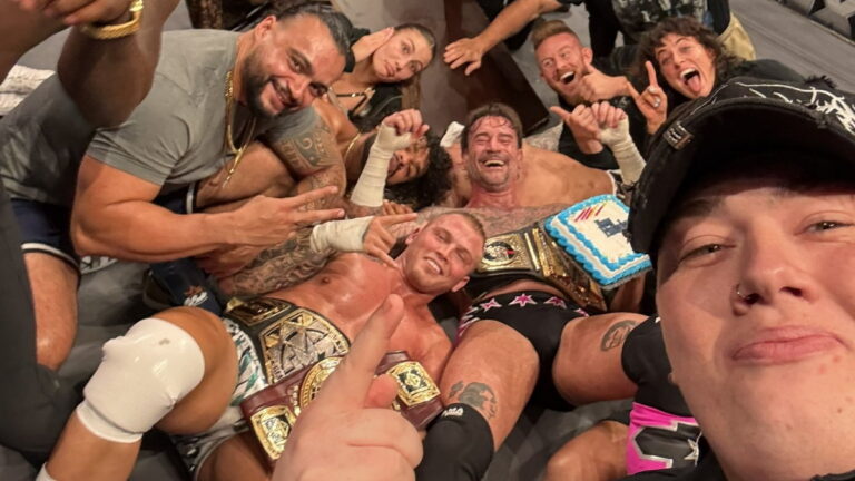 CM Punk and various WWE NXT stars following his live event appearance in Petersburg, Virginia