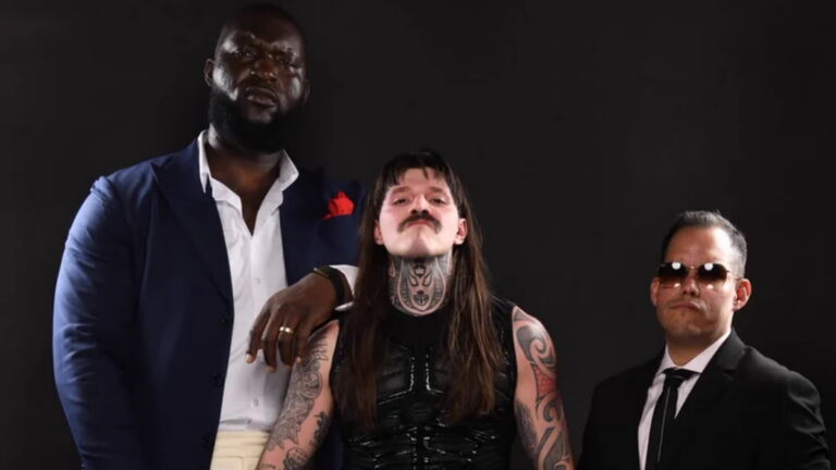 WWE stars Omos and Dominik Mysterio with Dorian Roldan as El Ojo in AAA