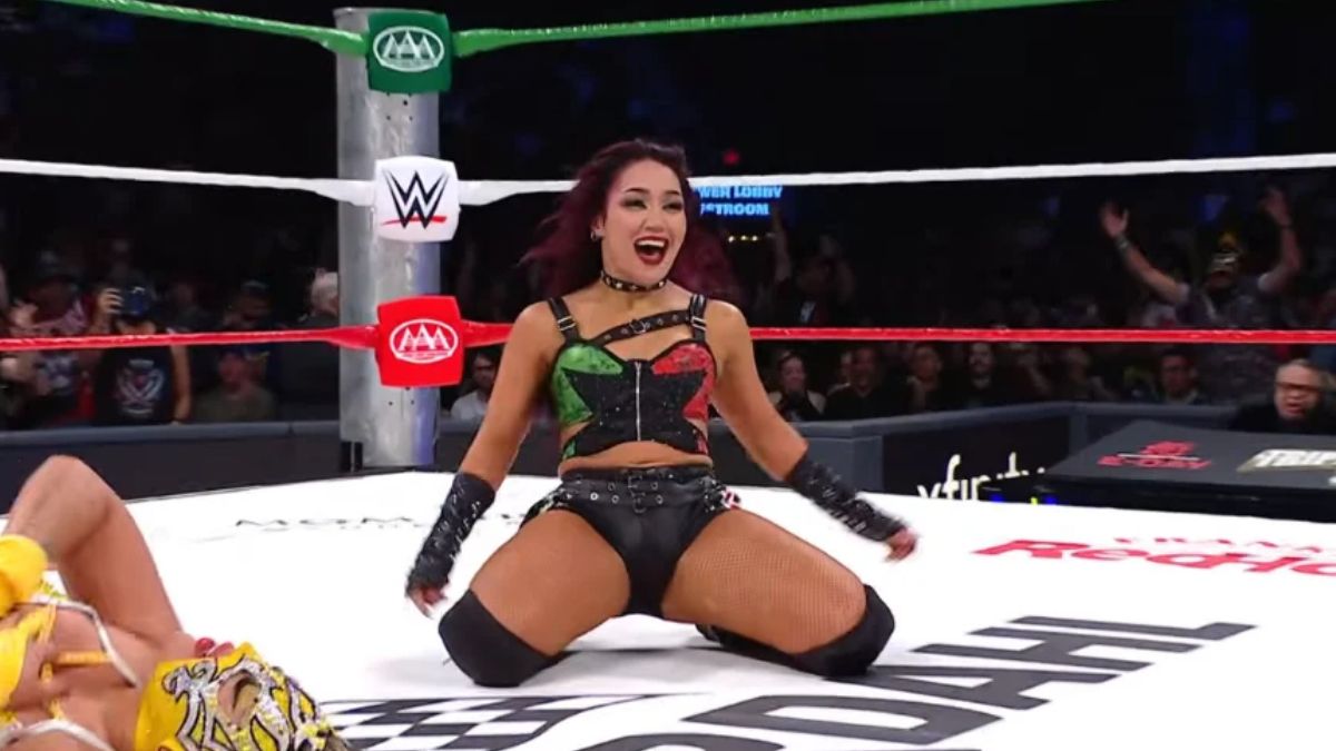 WWE star Roxanne Perez in ring smiling after winning at AAA Triplemania