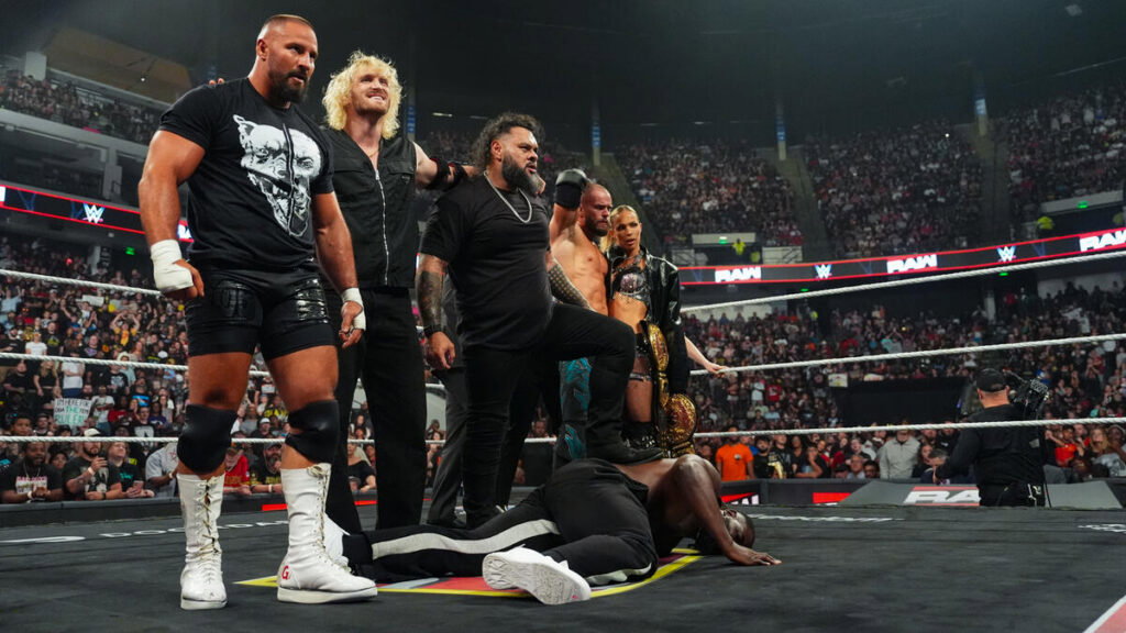 WWE's The Vision standing over Oba Femi on Raw.