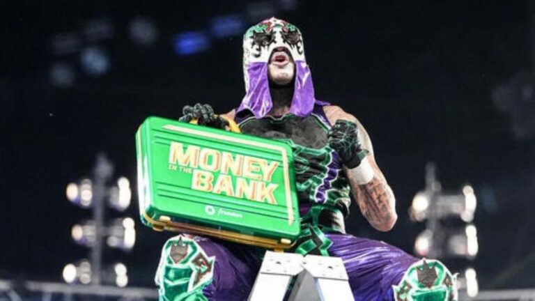 Penta with the WWE Money in the Bank briefcase