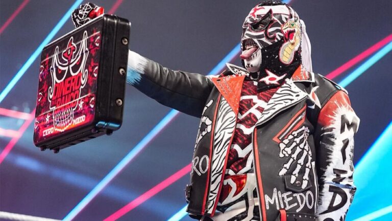 Penta with the WWE Money in the Bank briefcase
