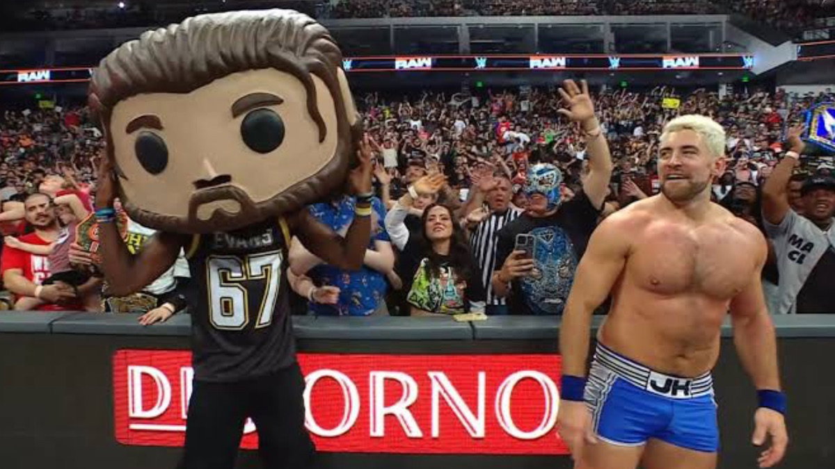 Je'Von Evans wearing giant Funko Pop head with Joe Hendry